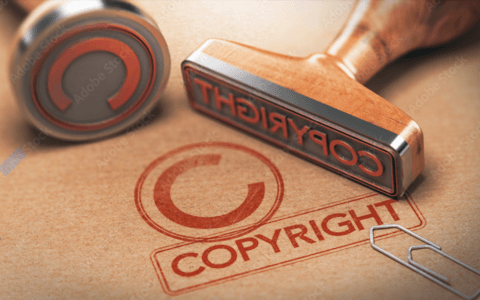 Copyright symbol with wooden mallet