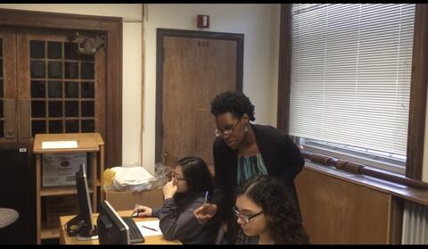 Librarian instructing students
