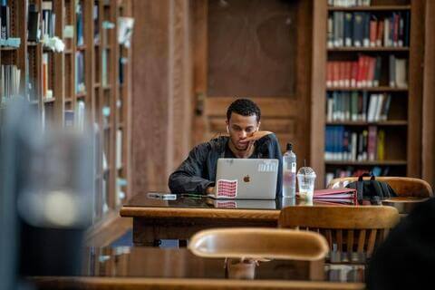 African American student using laptop