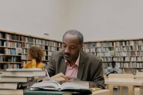 Professor in the library