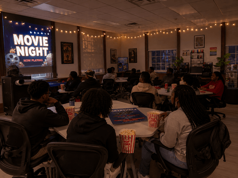 Students watching a movie in the Makerspace. 